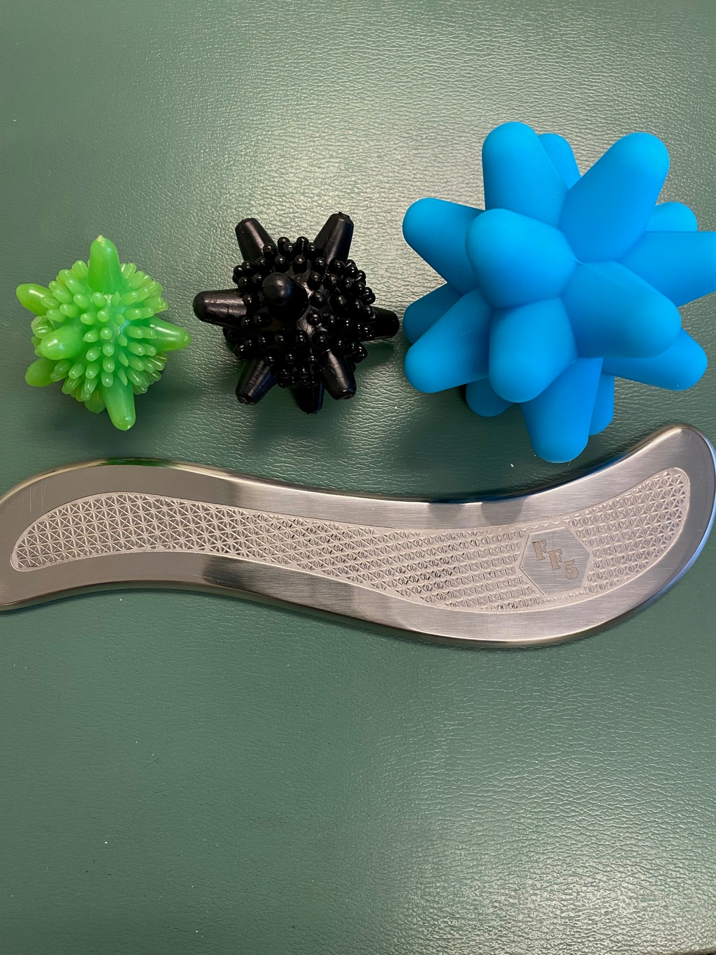 Massage balls and muscle scraper